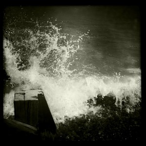 wave crashes ashore at Sheringham  -featured in the 2011 photo book sea sky sand and street