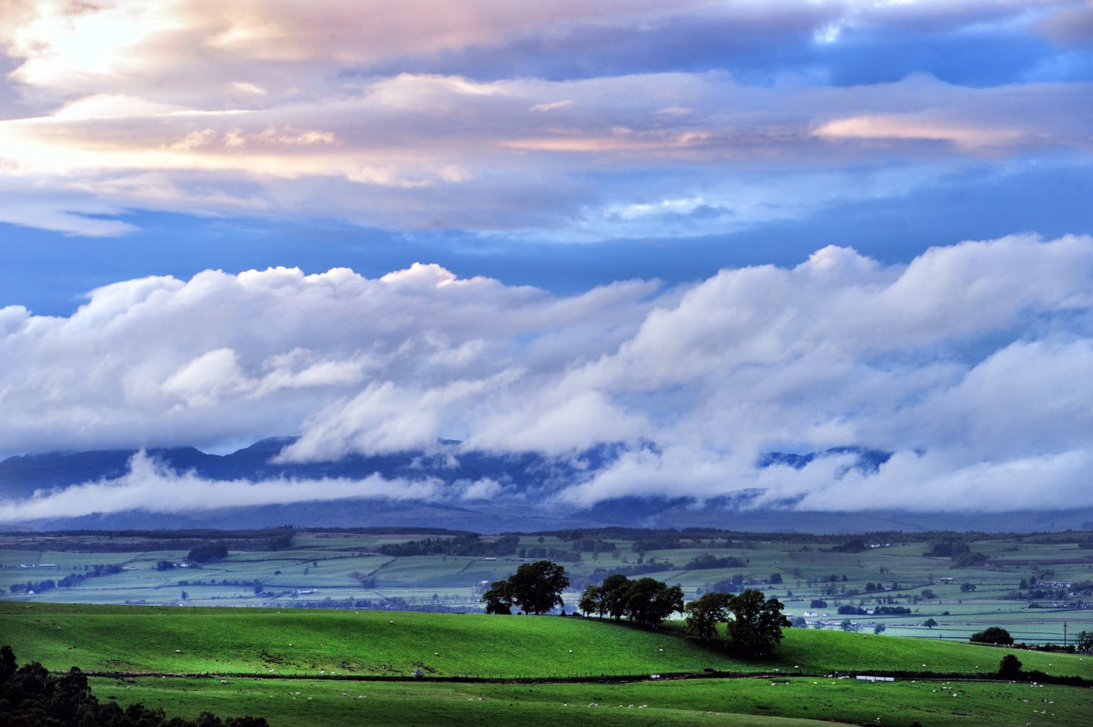 Clouds over the mountains and hills of the Trossachs, Scotland