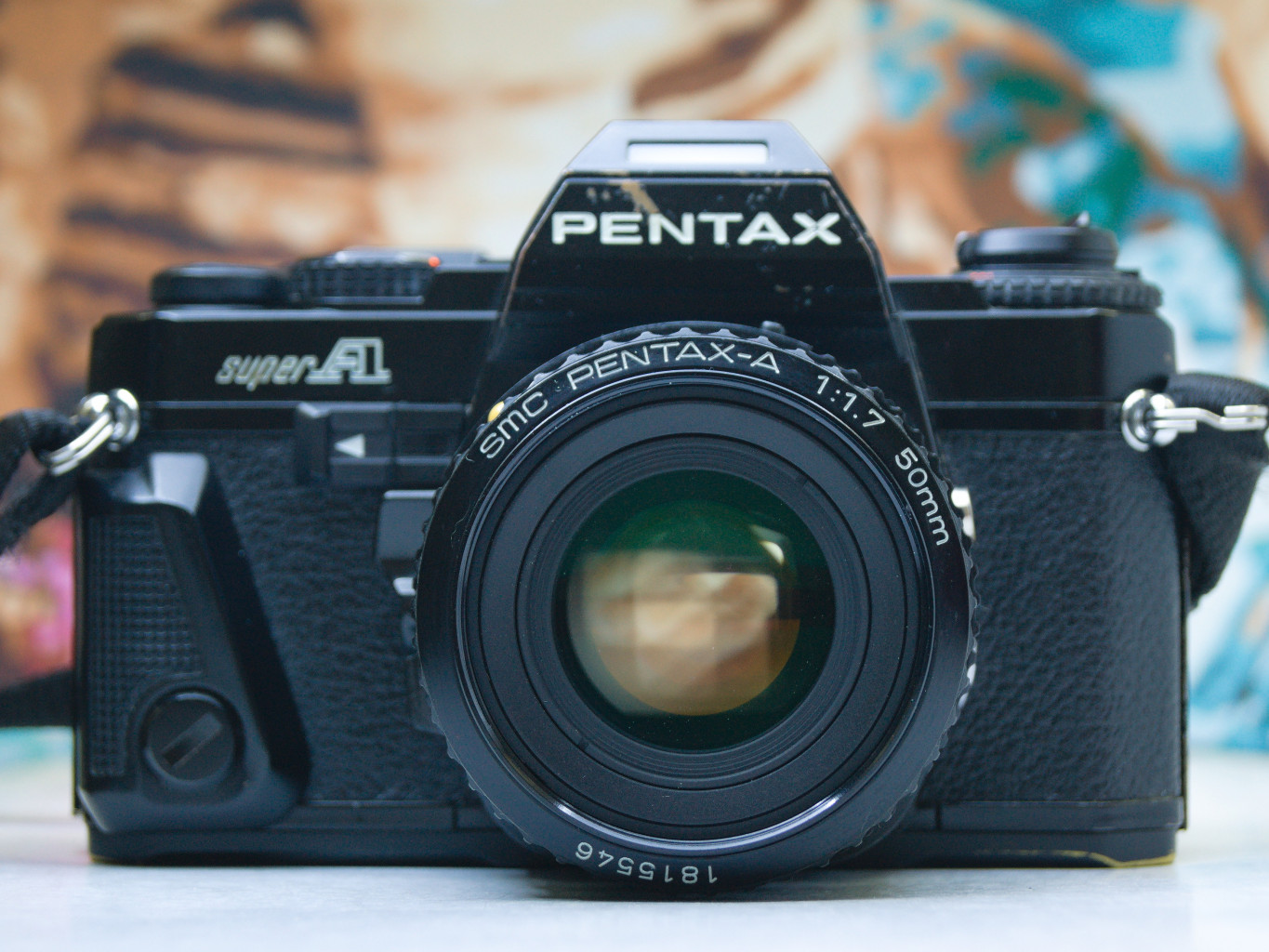 the front of a Pentax Super A 35mm film camera with a 50mm lens
